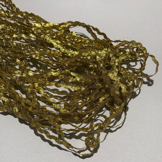 Band - Tygband Skimmer Vågig Guld 0,5cm 43