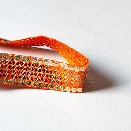 Paljettband guld och orange med runda paljetter i sicksackmönster på satinbas, 3,5 cm